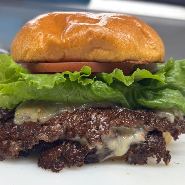 Indulge in Our Triple Cheeseburger